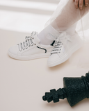 Sneakers in pelle con fondo chunky e dettagli grafici