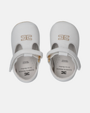 Ballerine da culla con chiusura in velcro e logo dorato