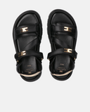 Sandali neri chunky in pelle con monogramma oro