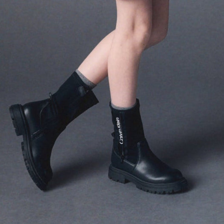 Stivali in pelle sintetica con zip e suola carrarmato