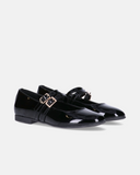 Ballerine Tommy Hilfiger da bambina in vernice con doppio cinturino e fibbie metalliche, fodera in pelle e fondo basso.