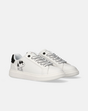 Sneakers da bambina nere Tommy Hilfiger con dettagli Snoopy e flag iconica.