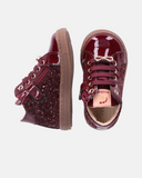 Sneakers bambina in vernice con glitter e fiocco gioiello