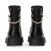 Combat boots with chain and golden accessory