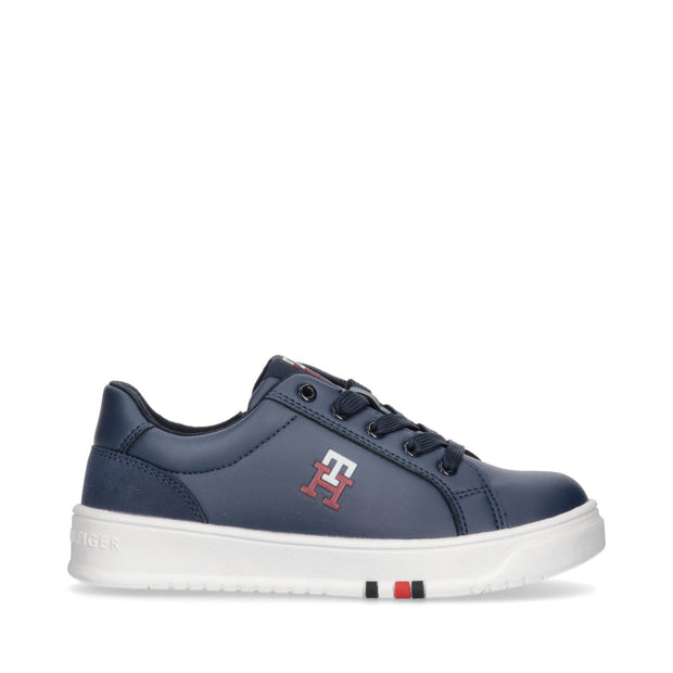Sneakers with TH initials and flag